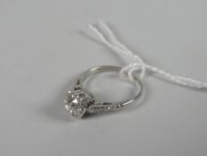 A platinum set diamond ring with diamond chip shoulders, visual estimate 1.1ct Condition reports