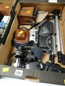 Approx ten assorted cameras including retro 1950s film cameras, Canon SLR with lens, Agfa Silette