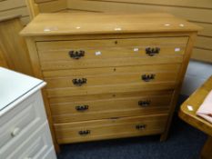 A vintage lightwood chest of four long drawers Condition reports provided on request by email for
