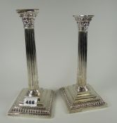 A pair of silver Corinthian column stepped candlestick holders Condition reports provided on request