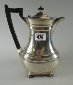 George V silver hot water jug / coffee pot of baluster form raised on four ball feet, Sheffield