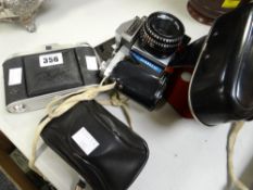 A vintage Agfa Isolette camera, a Praktica Nova 1B camera & another Condition reports provided on