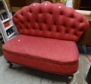 An antique button back fan-shaped settee on turned walnut supports with castors Condition reports