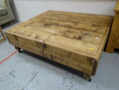 A reclaimed pine Long John coffee-table on casters Condition reports provided on request by email