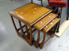 A mid-century G-Plan nest of three coffee tables Condition reports provided on request by email