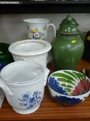 Victorian wash jug, two pottery planters, a pair of green lidded jars and covers and a floral