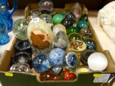 Mixed collection of glass and other paperweights, furniture foot stands etc