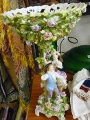 Continental porcelain floral encrusted and figural fruit comport (damages)