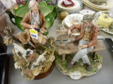 Two large Capodimonte figurines of elderly gents, one seated on a bench feeding a squirrel, the