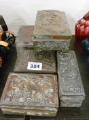 Five Oriental metal lidded trinket boxes with various patterns in relief