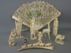 Collection of circa 1900 carved ivory, bone and moulded figures with a boxed painted silk fan