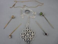 Stylized silver pendant on chain, a nine carat gold fine necklace, small dress ring with seed