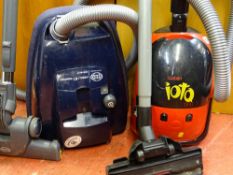 Small Goblin IOTO 1300w cylinder vacuum cleaner and a Sebo Airbelt K1 Komfort 2100w vacuum cleaner