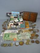 Collection of vintage book matches and a vintage tin of British and overseas coinage and notes etc