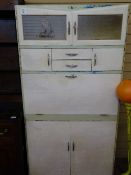 Vintage painted kitchen cabinet with 'Fortress' label