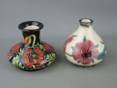 Cobridge stoneware pottery - two squat vases with floral decoration
