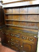 Antique oak and pine North Wales dresser with wide boarded three shelf rack over a base