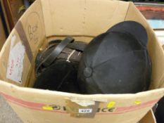 Two horse riding hats, a quantity of bits, leads, straps etc