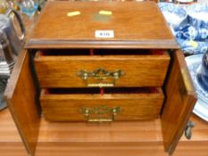 Oak two door tabletop cabinet with twin interior drawers