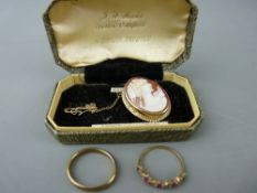 Nine carat gold wedding band, a dress ring with a ruby type leaf setting and a nine carat gold