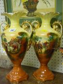 Pair of printed and painted twin handled pottery vases