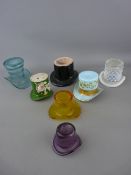 Collection of glass and pottery ornaments in the shape of hats