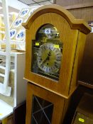 Mid Century reproduction grandmother clock with chiming movement and 1976 presentation plaque