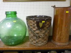 Green glass carboy, wicker basket and a cylindrical copper vessel with carry handle