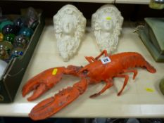 Plastic model of a lobster and a pair of composition wall mounted display stands