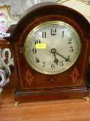 Dome topped inlaid mahogany mantel clock with pendulum and key for a gong chime movement