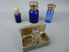 Three Bristol blue smelling salts bottles, various metal tops, small cherub cased example in clear