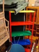 Metal multi-shelf, multi-coloured rack, a pair of folding plastic garden chairs and a metal circular