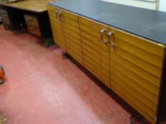 Excellent quality, possibly Scandinavian designer desk having a wood veneer top with faux leather