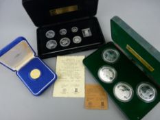 Silver and gold coins including two Pobjoy sets, a 1978 Isle of Man legal tender commemorative for