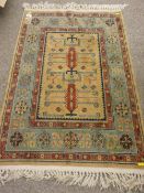 Eastern style woven carpet, multi-bordered with stylized central pattern and tasselled ends