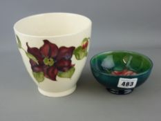 Moorcroft 'Anemone' pottery bowl, 11 cms diameter and a Moorcroft 'Clematis' vase, 13 cms high