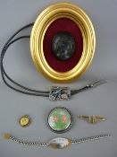 Victorian type black cameo mounted in a gilt frame, a Victoria pendant in a yellow metal mount, a