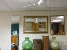 Parcel of three wall mirrors, one bevelled with floral decorated frame