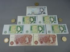 Five two pound coins, five late period one pound notes, two ten shilling notes and a GM Gill five