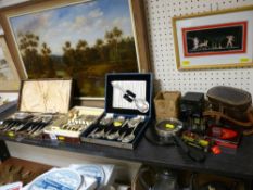 Three cased quantities of cutlery, a vintage Kodak Baby Hawkeye camera, two vintage tins etc