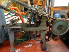 Metal saw bench with embossed title 'New Manchester Saw' E/T