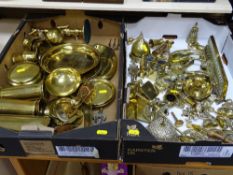 Two boxes of decorative brassware including trench art, horse brasses etc