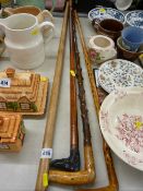 Four vintage walking sticks, one having dog's head handle inscribed 'W F Little'