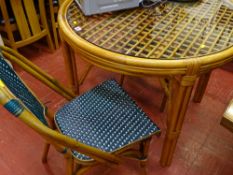 Modern bamboo glass topped circular table and four chairs
