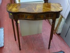Reproduction crossbanded walnut serpentine front two drawer hall table