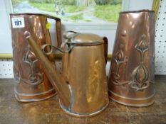 Pair of Arts & Crafts style copper jugs (damage) and another copper jug
