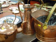 Two copper kettles, a beaten copper water jug, a helmet coal scuttle with similar contents and a
