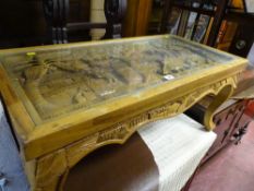 Oriental deep carved glass topped coffee table