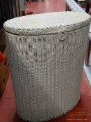 White finished oval wicker laundry basket