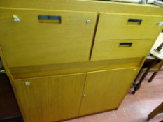 Four piece suite of light wood office furniture